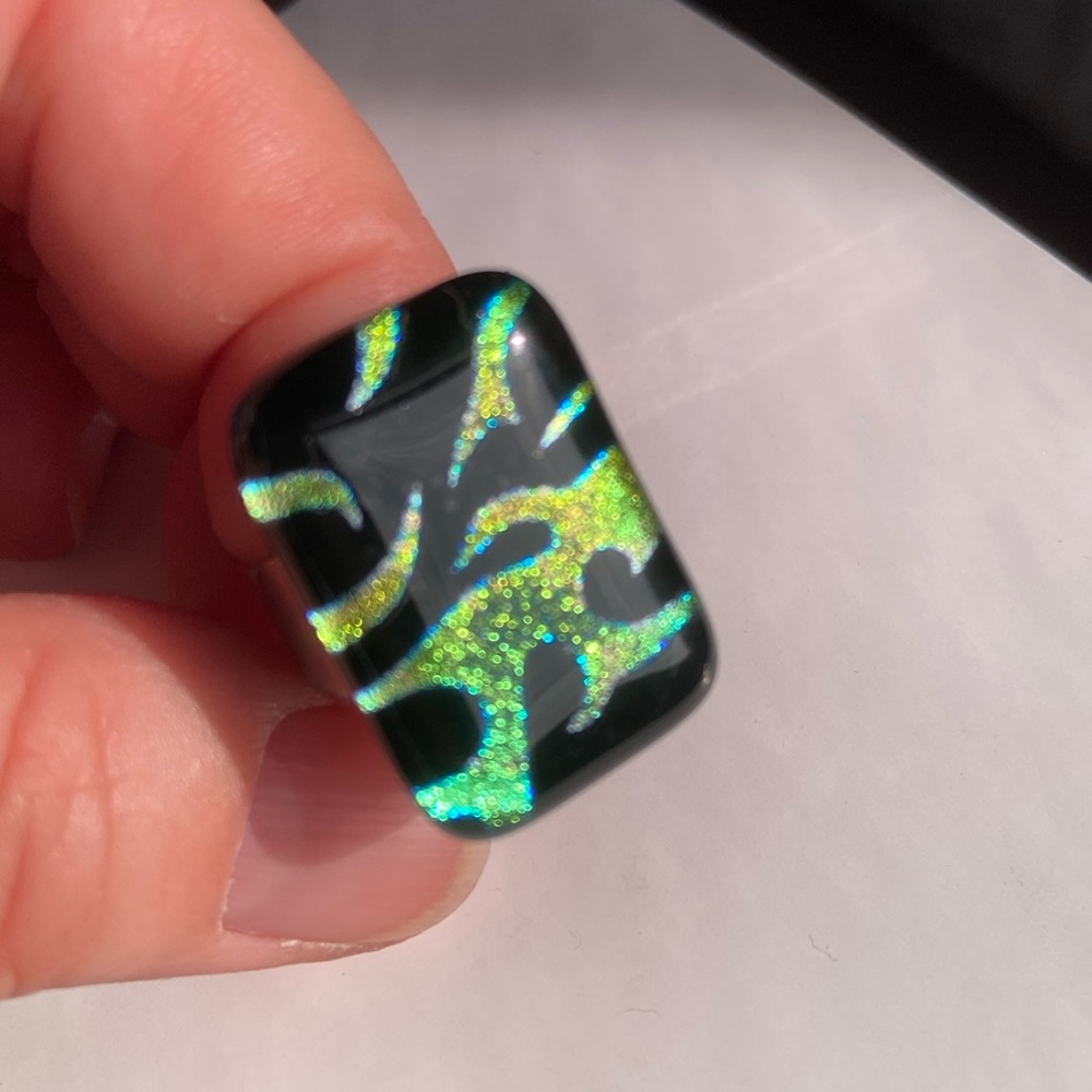 Green and black stone ring